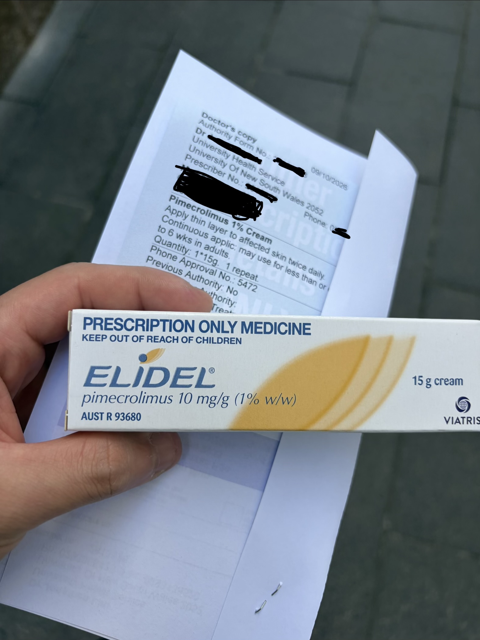 Elidel cream box and the prescription from my GP, with identifying details obscured.