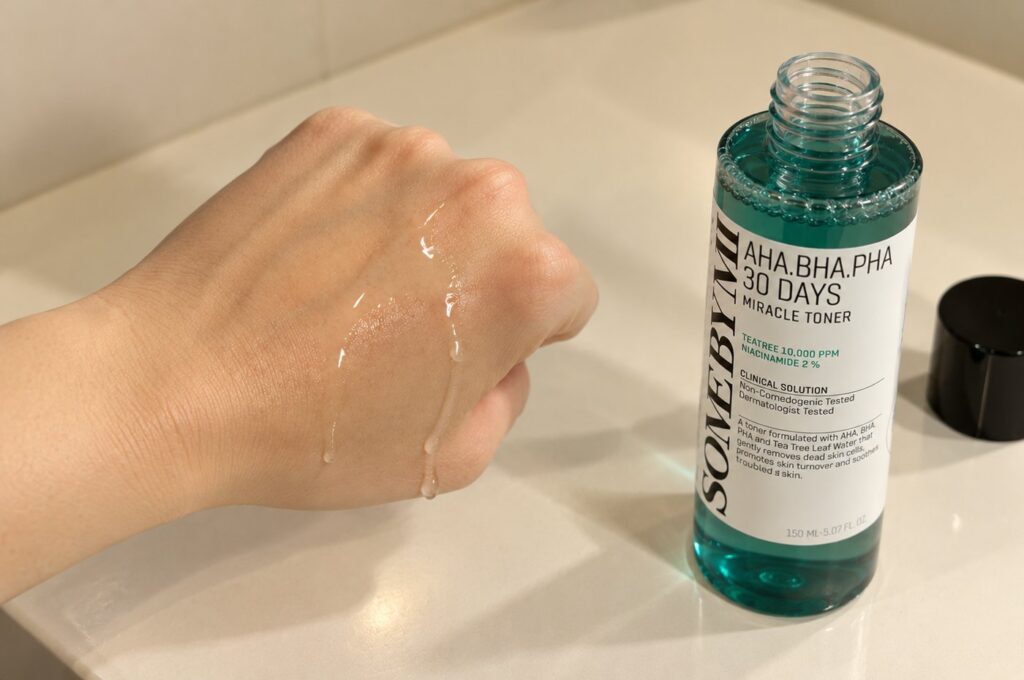 Some By Mi AHA BHA PHA 30 Days Miracle Toner bottle next to toner on the back of a hand